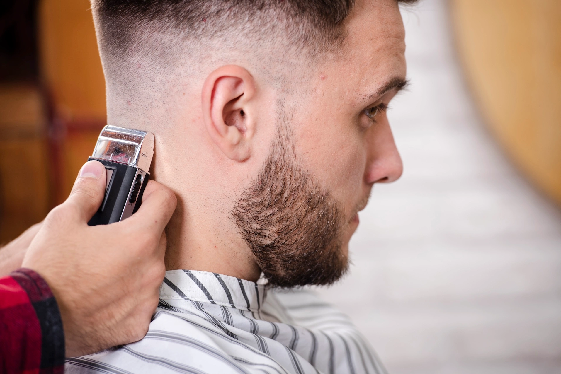 close up barber finishing haircut